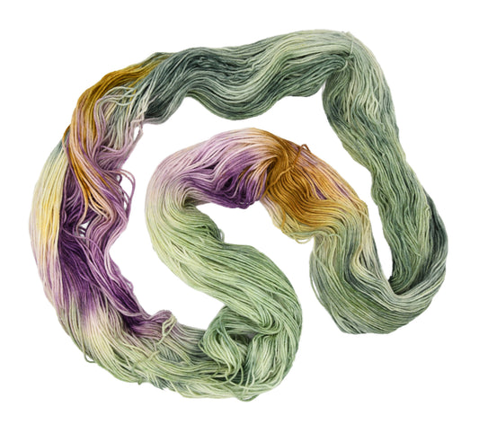 100g skein of fingering weight merino/cashmere/nylon yarn in Pistachio purple/pink/green/yellow hand dyed