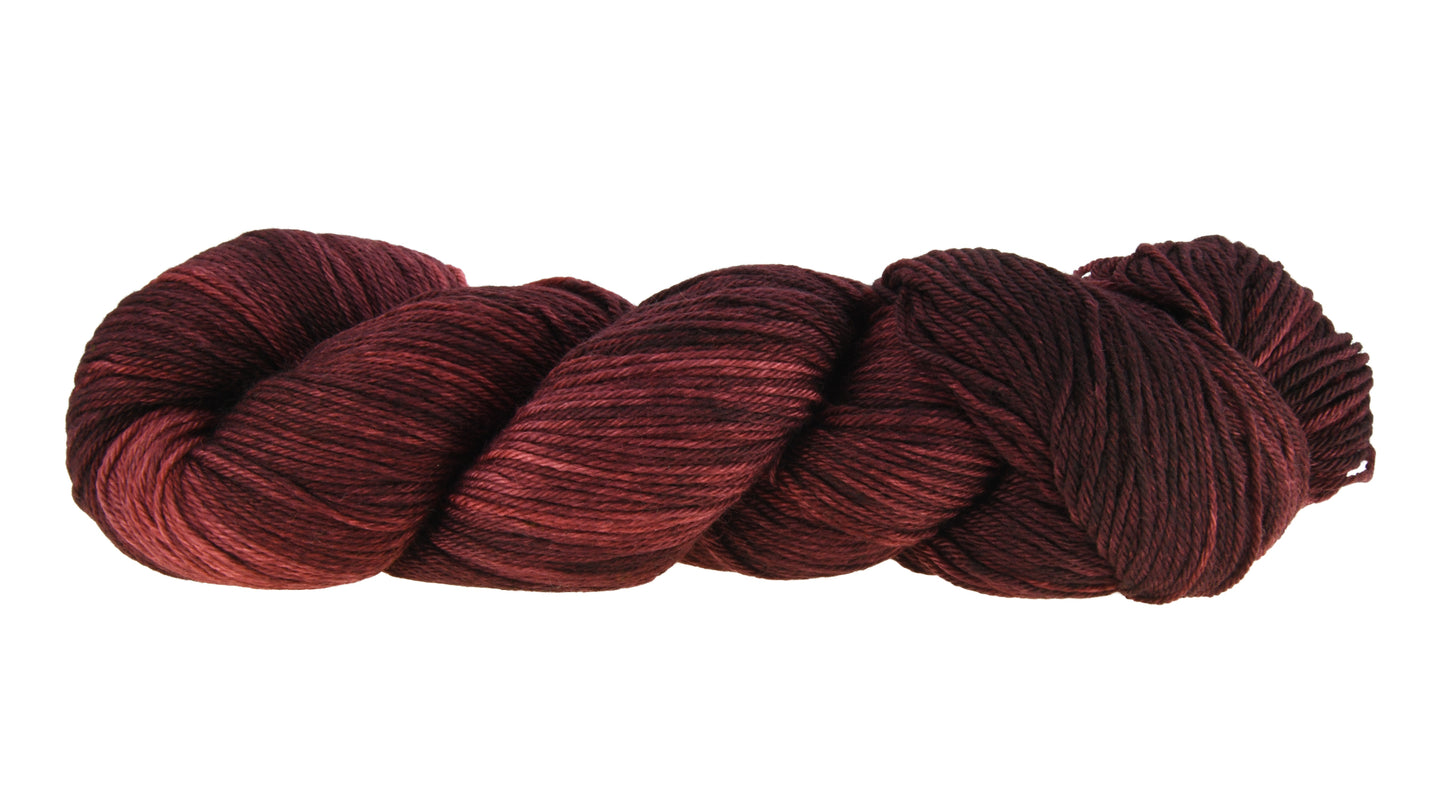100g skein of fingering weight merino/cashmere/nylon yarn in Chocolate Moose red brown hand dyed