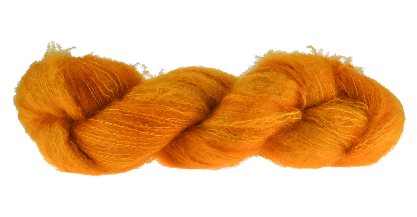 100g skein of lace weight mohair yarn in Golden Era orange/gold hand dyed