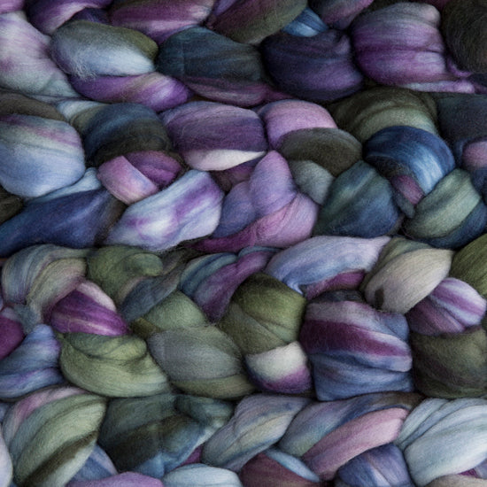 4 oz braid of unspun merino wool top in the Zarzamora colorway, purple/green/blue roving hand dyed