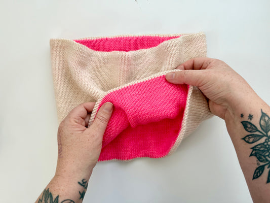 White cowl with bright pink interior lining showing how this pattern is reversible