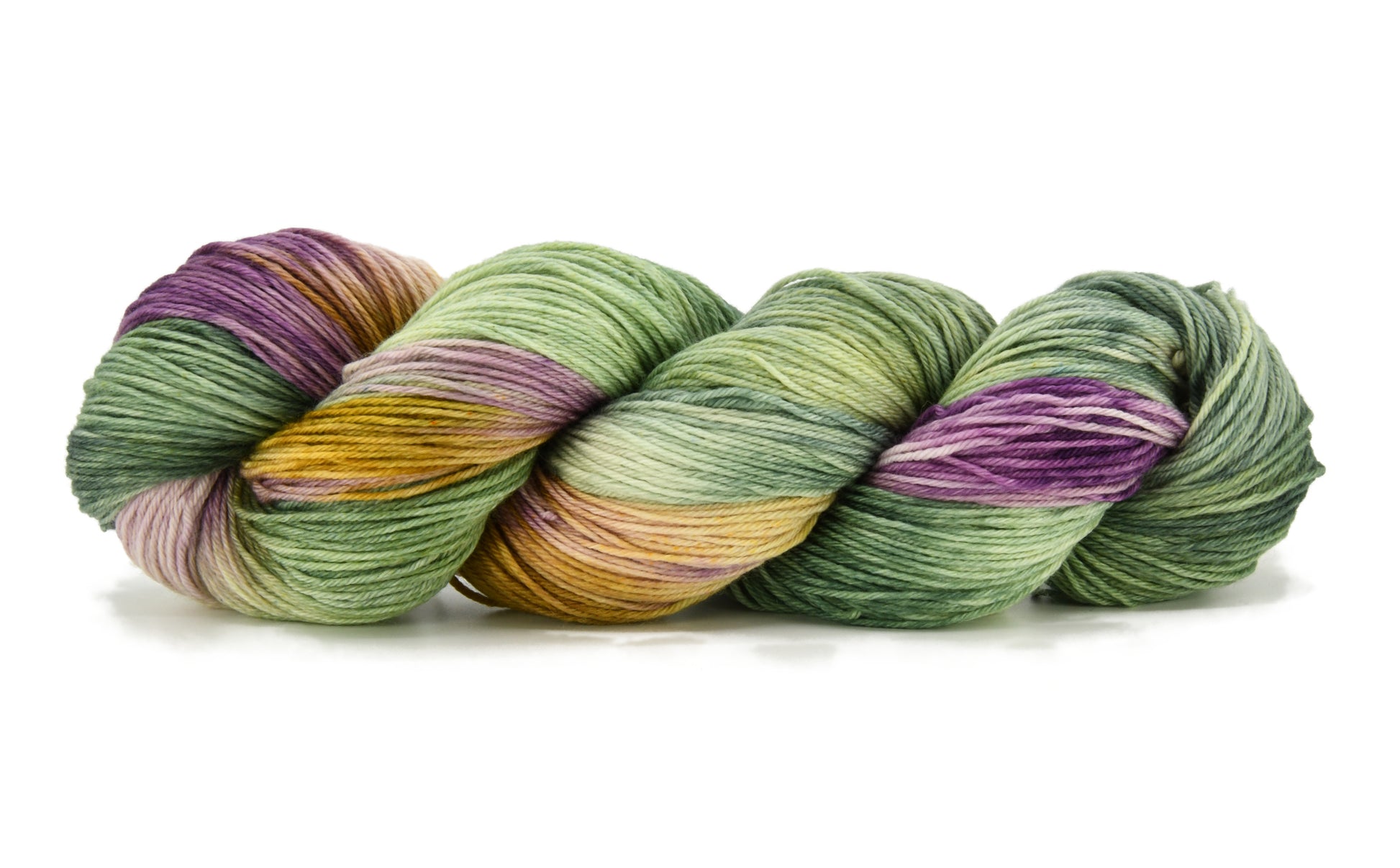 100g skein of fingering weight merino/cashmere/nylon yarn in Pistachio purple/pink/green/yellow hand dyed
